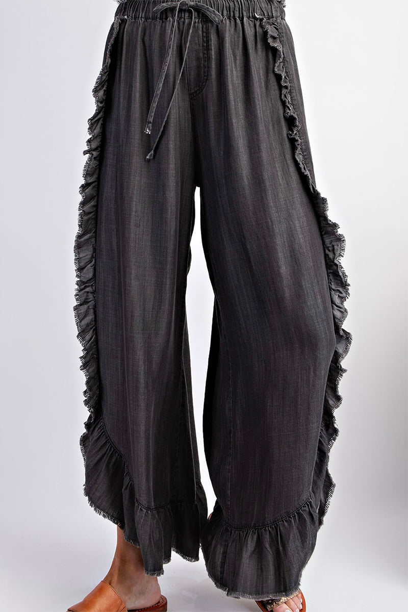 Vaqueros holgados de cintura alta con volantes y frenillo liso informales