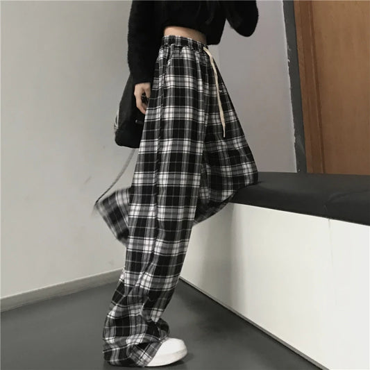 Pantalones deportivos de gran tamaño para mujer, a la moda, negros, a cuadros, informales, holgados, con cintura elástica y bolsillos, unisex, estilo hip hop para estudiantes.