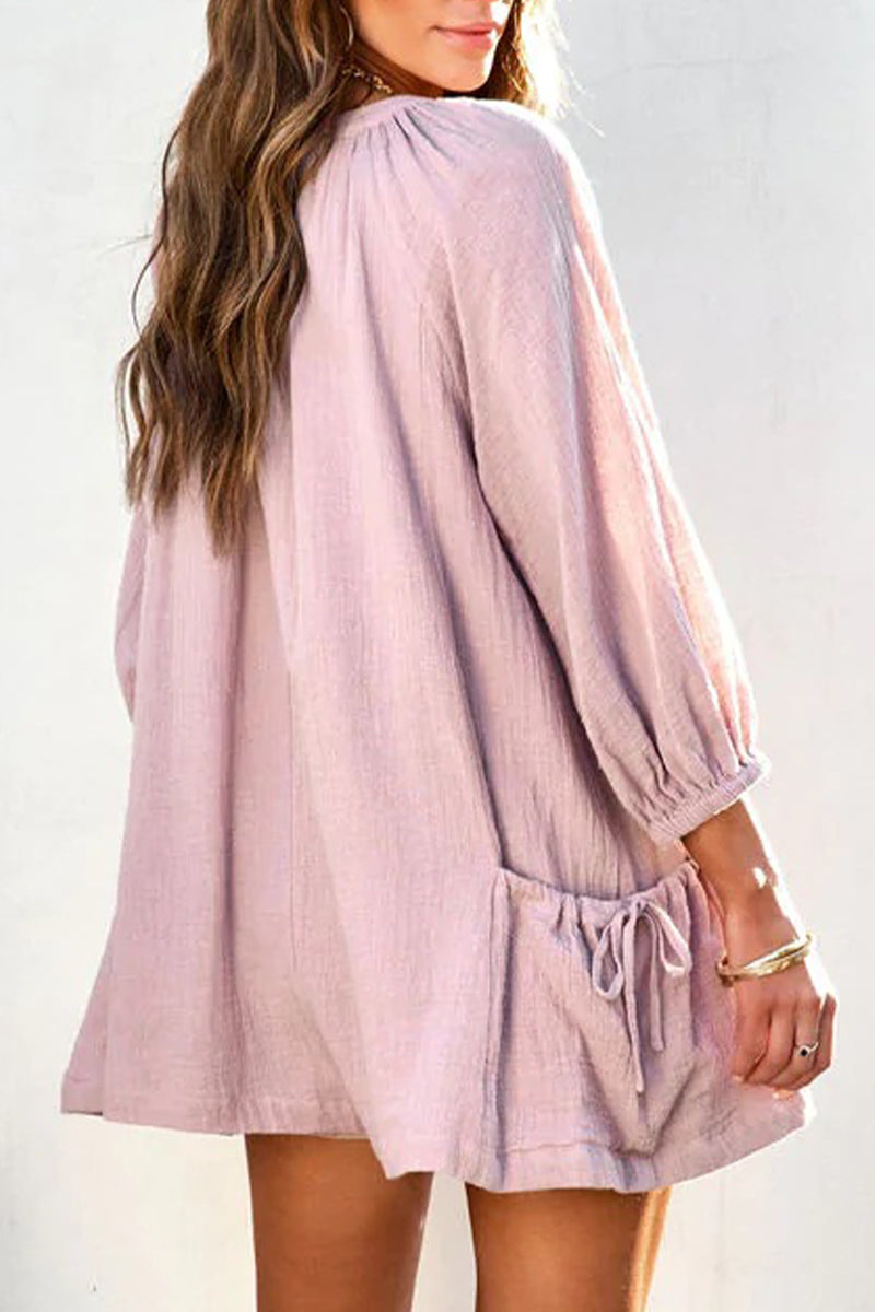 Mono holgado informal con escote en V y bolsillos lisos y sencillos