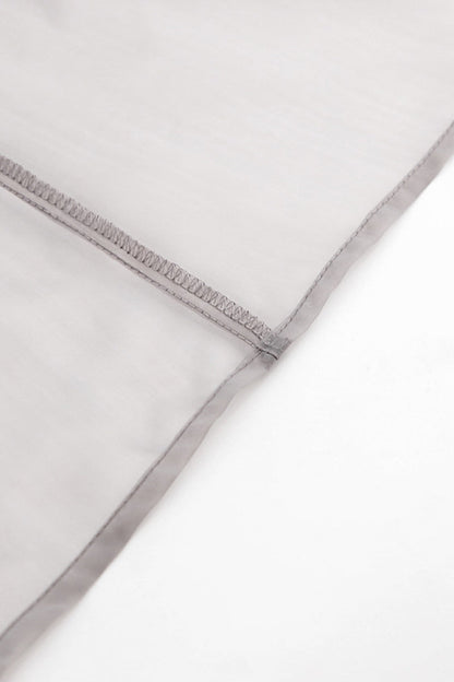 Elegante blusa lisa con cuello en V transparente y frenillo