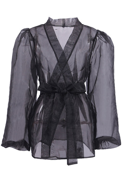 Elegante blusa lisa con cuello en V transparente y frenillo