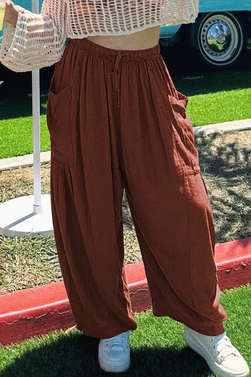 Pantalones casuales sencillos de color liso con bolsillos, holgados, de cintura media y pierna ancha.