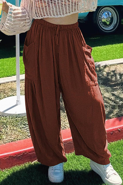 Pantalones casuales sencillos de color liso con bolsillos, holgados, de cintura media y pierna ancha.