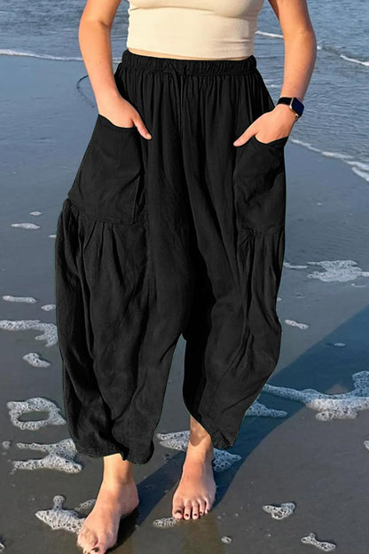 Pantalones casuales sencillos de color liso con bolsillos, holgados, de cintura media y pierna ancha.