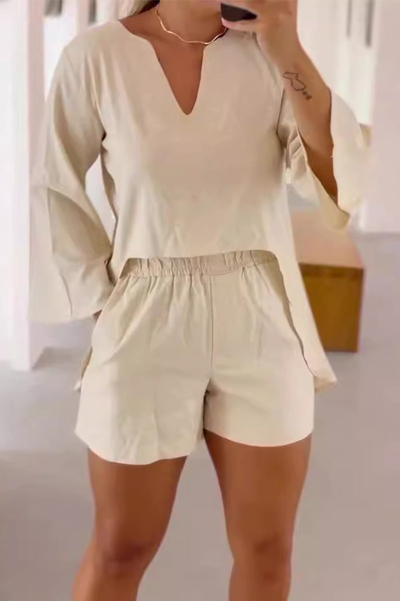 Conjunto informal de dos piezas con cuello en V, manga larga y bolsillos en color liso para uso diario.