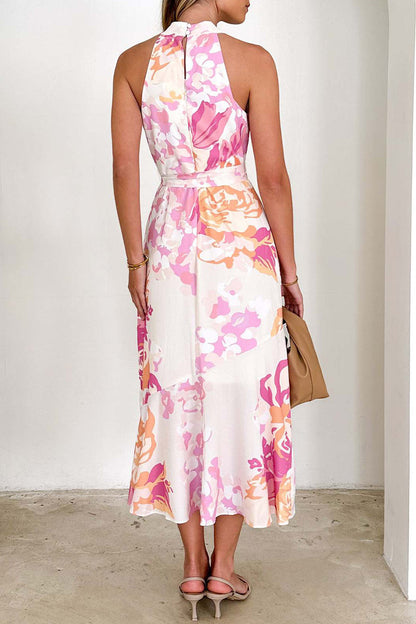 Elegante vestido irregular con volantes, cuello halter y estampado floral