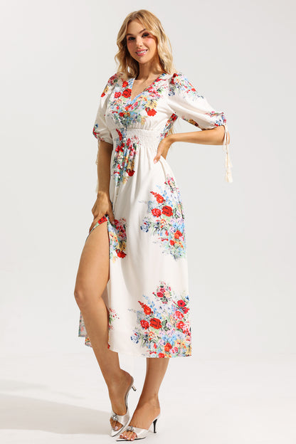 Vestido midi con mangas abullonadas y bajo floral 
