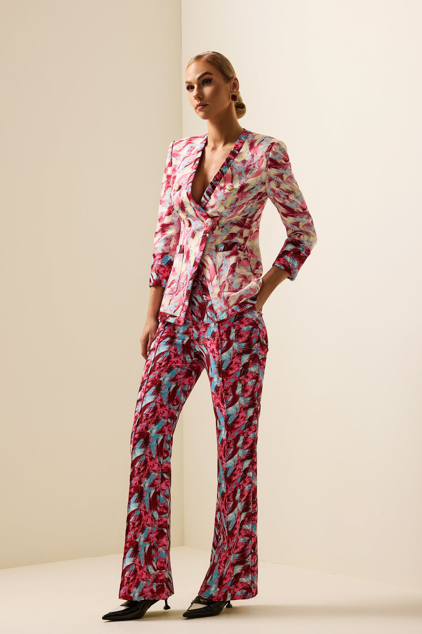 Pantalones holgados de cintura alta con estampado de plumas 