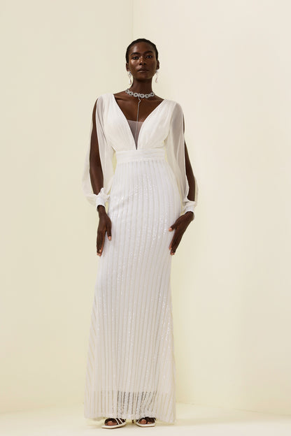 Vestido largo liso con lentejuelas y aberturas 