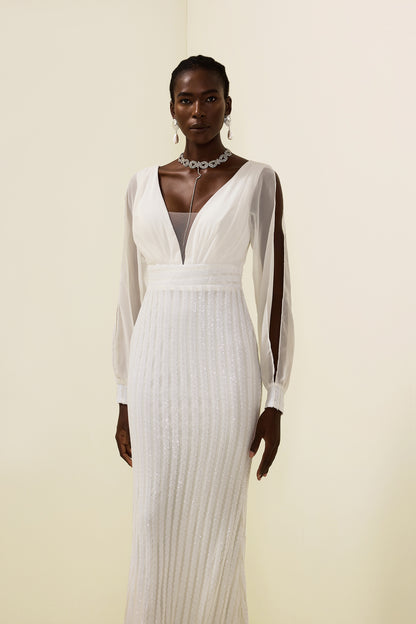 Vestido largo liso con lentejuelas y aberturas 