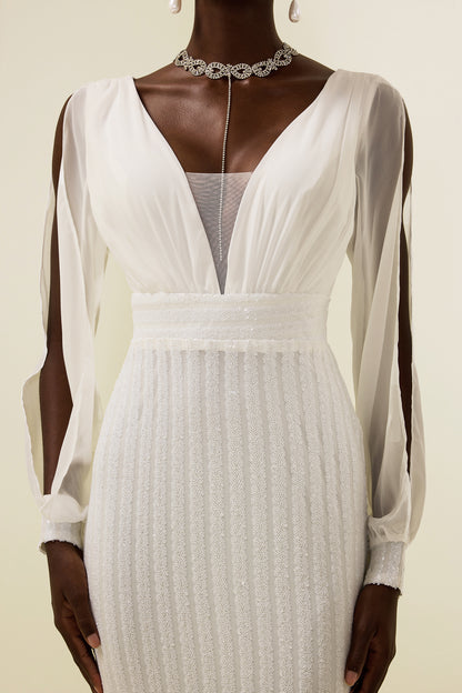 Vestido largo liso con lentejuelas y aberturas 