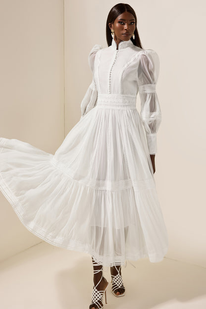 Vestido midi de encaje con mangas abullonadas y cuello alto 