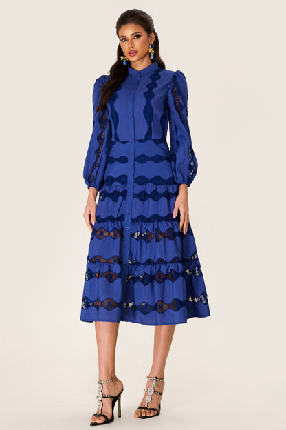 Vestido midi con bajo liso bordado 