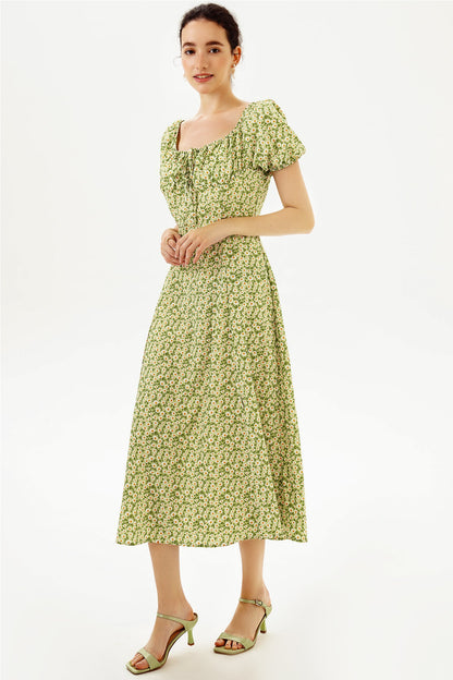 Vestido midi con mangas abullonadas y abertura floral 