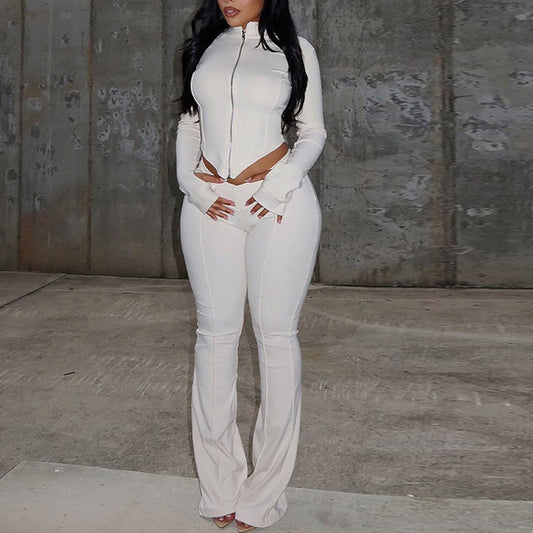 Conjunto de dos piezas formado por blusa corta, pantalón, manga larga, cuello alto, holgado, color liso, plisado y con cremallera para mujer