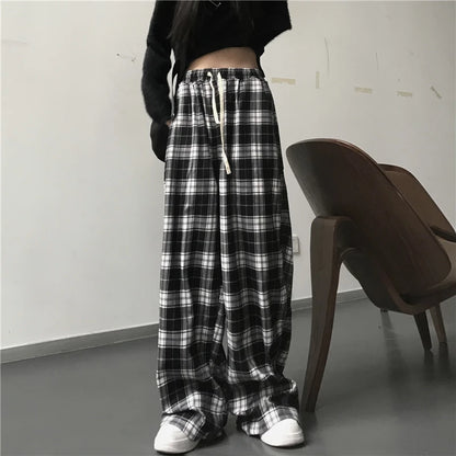 Pantalones deportivos de gran tamaño para mujer, a la moda, negros, a cuadros, informales, holgados, con cintura elástica y bolsillos, unisex, estilo hip hop para estudiantes.