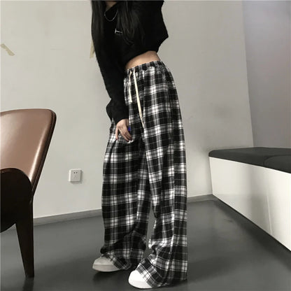 Pantalones deportivos de gran tamaño para mujer, a la moda, negros, a cuadros, informales, holgados, con cintura elástica y bolsillos, unisex, estilo hip hop para estudiantes.