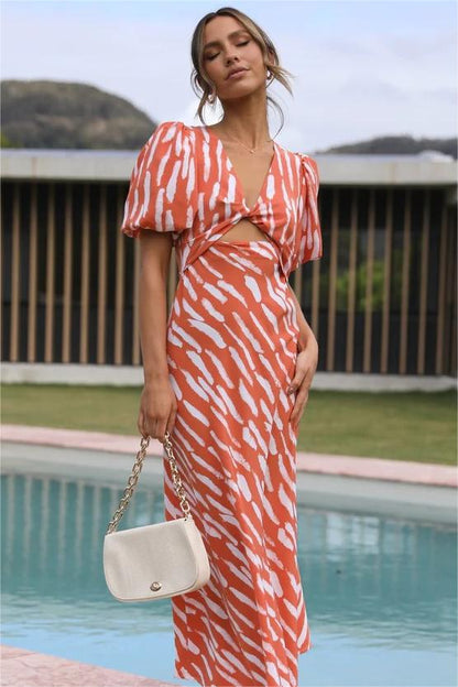 Vestido midi con abertura y escote en V, mangas abullonadas y estampado 