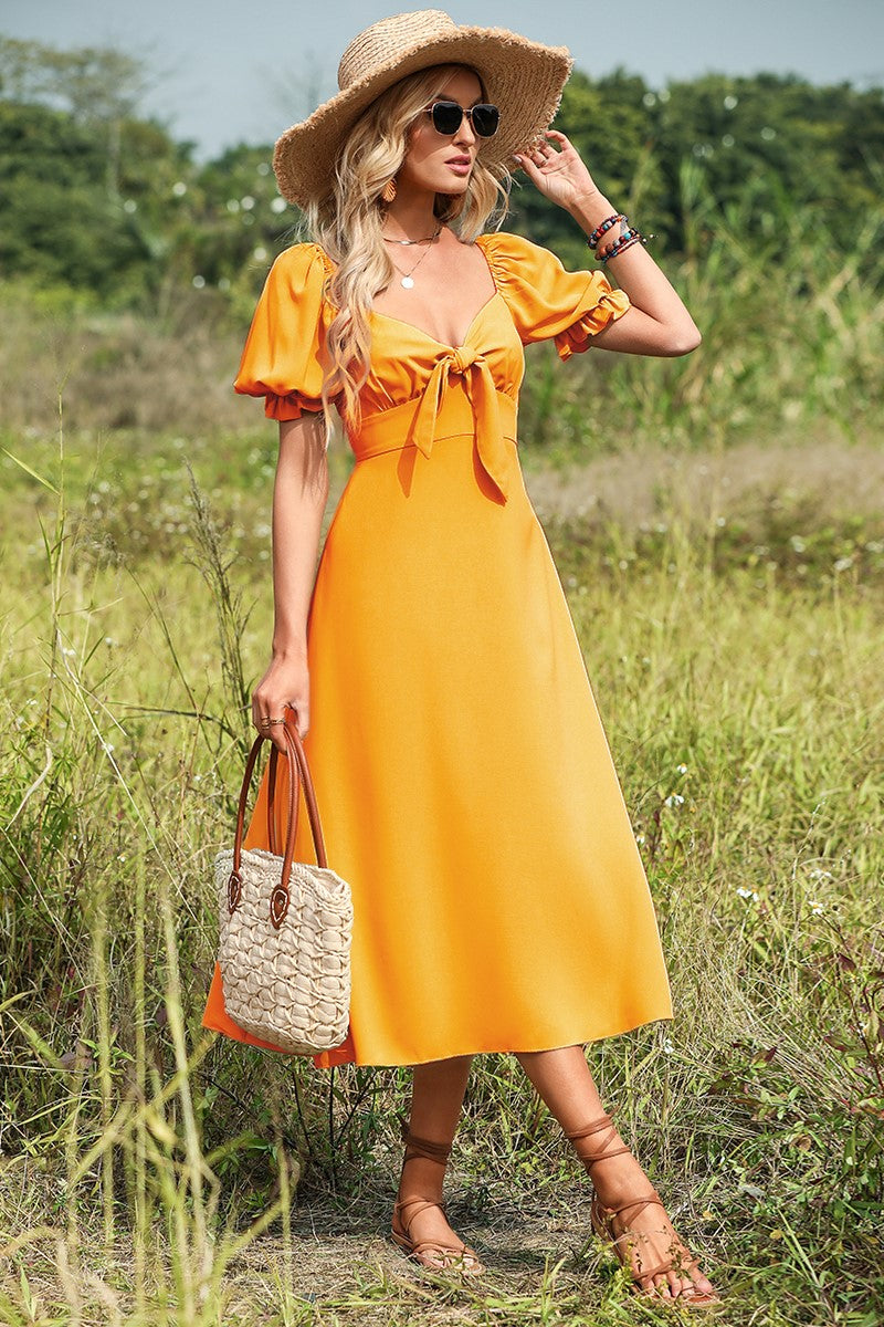 Vestido midi amarillo con lazo y mangas abullonadas 