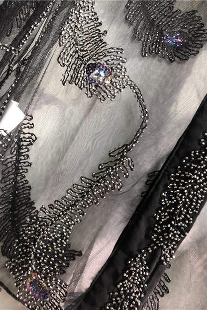 Blusa de malla con cuentas y plumas Denise 