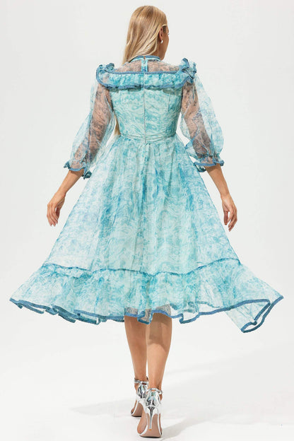 Vestido midi con volantes, mangas farol y cuello redondo estampado 