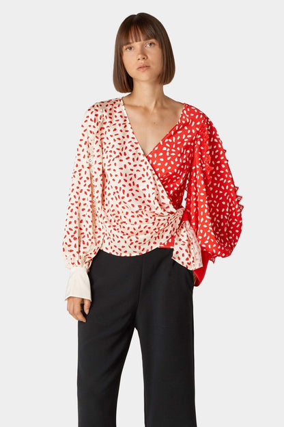 Blusa cruzada con mangas farol y lunares 