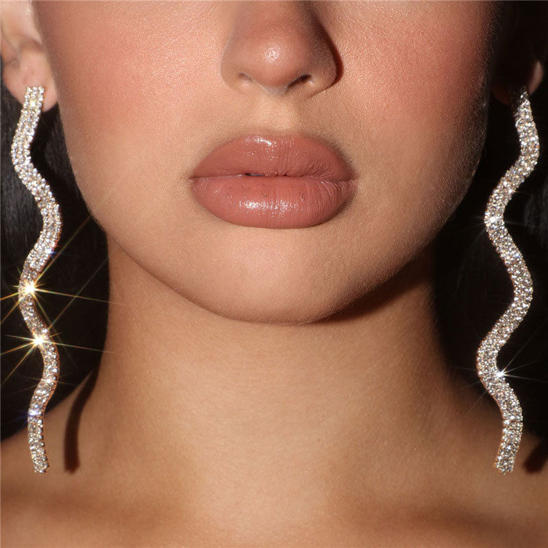 Silver Long Drop Earrings with Sparkly Wavy Rhinestone Embellishments