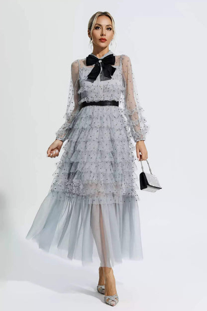 Vestido midi de manga larga con cuello camisero y lazo con volantes 