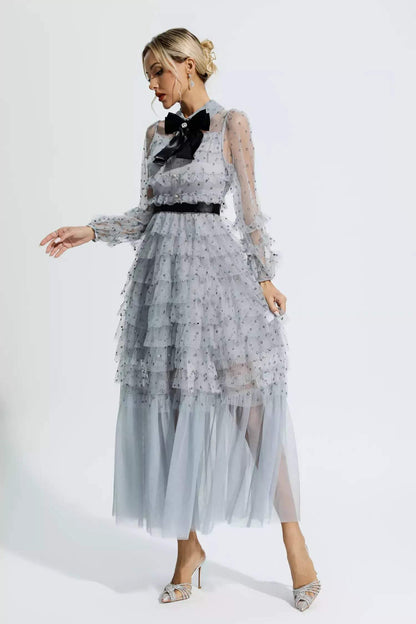 Vestido midi de manga larga con cuello camisero y lazo con volantes 